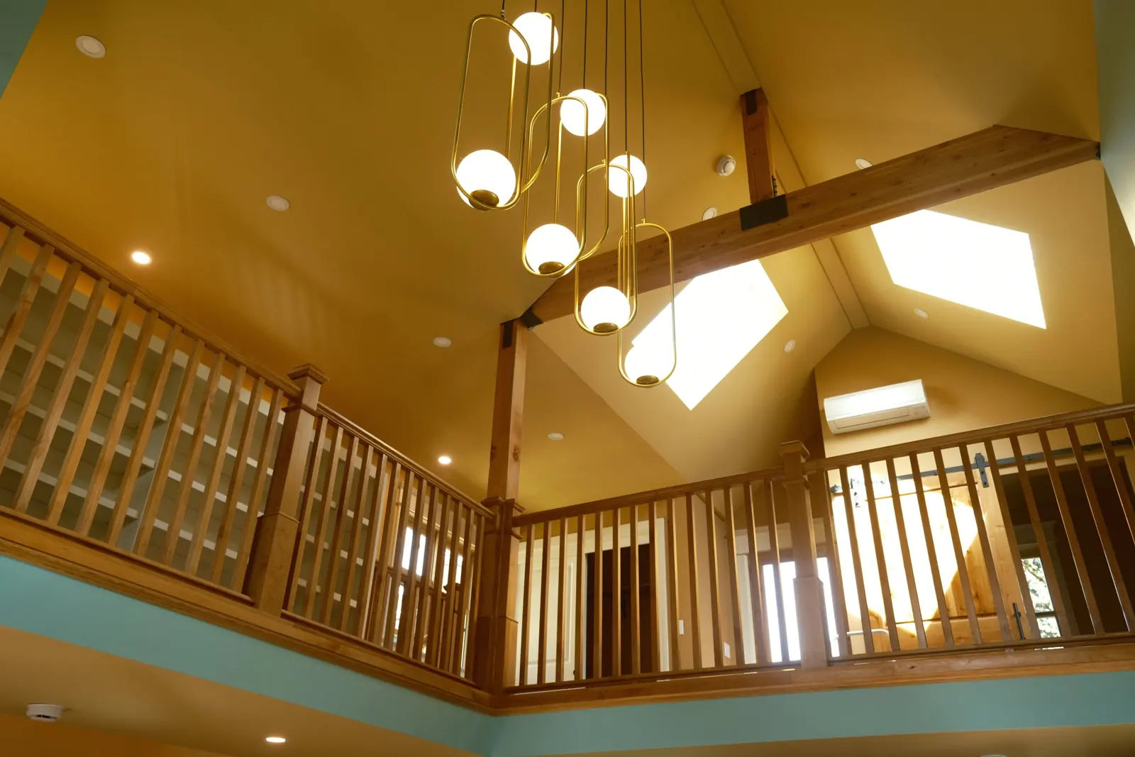 Interior of a new ADU in Portland with vaulted ceiling and loft railing