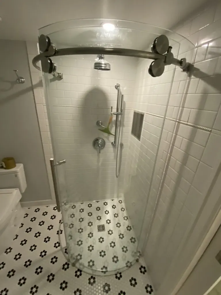 Basement Bathroom install with Curved glass shower