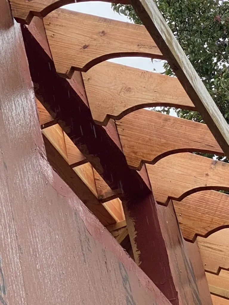 Ornate custom rafter tails on a Portland craftsman house