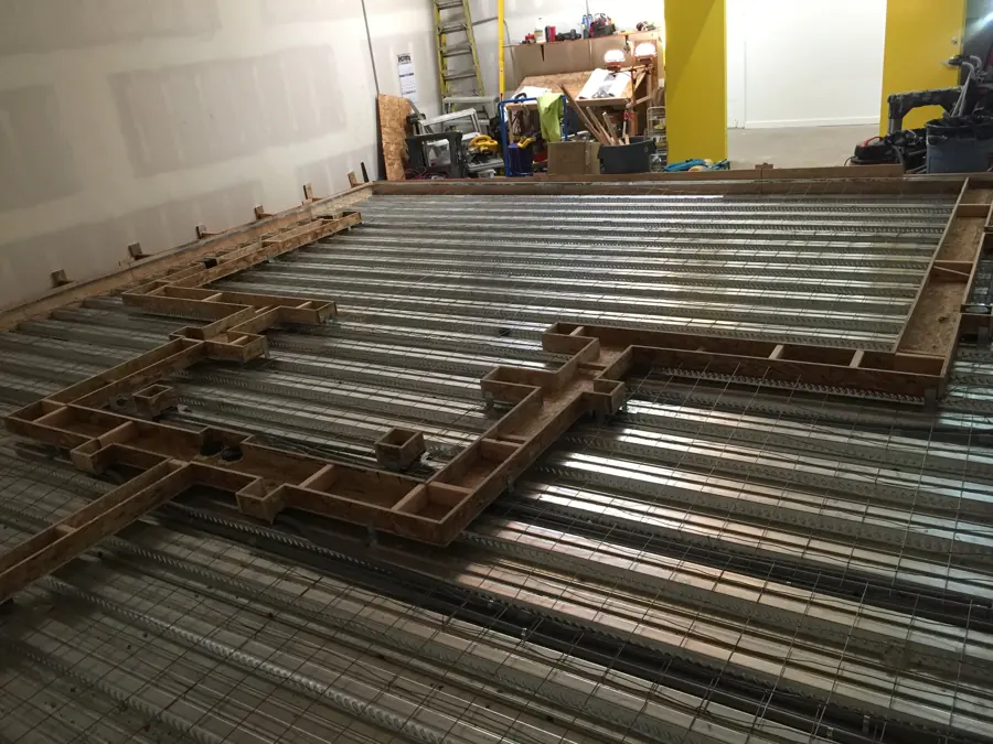 Channels for cables set in floating concrete floor